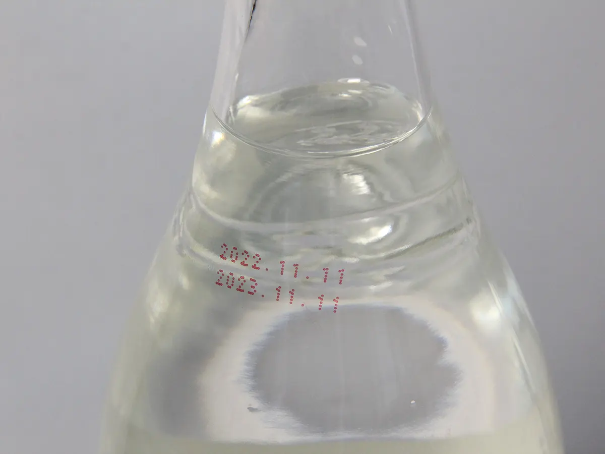 Маркировка красными чернилами на стеклянной бутылке принтером Saturn K710